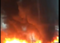 GNFS struggles to contain a large fire at a rubber factory in Circle as heavy rainfall disrupts firefighting efforts.