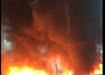 GNFS struggles to contain a large fire at a rubber factory in Circle as heavy rainfall disrupts firefighting efforts.